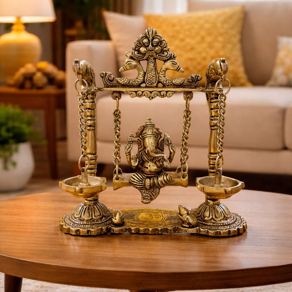 Brass Ganesh swing idol with diya holders for gifting and home temple decoration