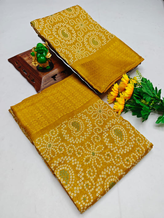 Two mustard yellow fabrics with white patterns on a white background