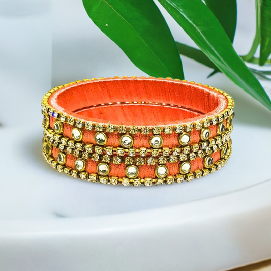 Pair of Silk thread bangles in orange